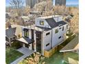 Aerial view of a modern home featuring a rooftop deck and contemporary design within a residential neighborhood at 357 S Franklin St, Denver, CO 80209