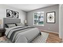 Serene bedroom with a large window, plush bedding, and modern accents for a restful retreat at 2575 S Syracuse Way # 101, Denver, CO 80231
