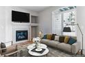 Relaxing living room showcases a fireplace, comfortable sofa, and stylish decor for cozy evenings at 2575 S Syracuse Way # 101, Denver, CO 80231