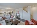 Cozy living room with modern decor, plush seating, and an open layout, perfect for entertaining and Gathering gatherings at 6536 13Th St, Frederick, CO 80530