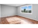 Bright bedroom with hardwood floors and large window at 316 Perry St, Denver, CO 80219