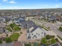 Spacious neighborhood showcasing lovely homes, tree-lined streets and well-maintained landscaping at 9353 Middle Fork St, Littleton, CO 80125