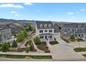 Two-story home featuring a charming front porch, landscaped yard and mountain views at 9353 Middle Fork St, Littleton, CO 80125