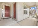 Inviting front porch with a cozy space to relax and enjoy the neighborhood views at 5226 Inland Ave, Firestone, CO 80504
