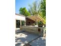 Exterior view of a custom outdoor living space with concrete features and pergola at 13905 Berry Rd, Golden, CO 80401
