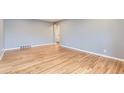 Bright living room featuring hardwood floors and neutral paint at 925 Wolff St, Denver, CO 80204