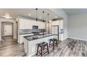 Modern kitchen boasts sleek granite countertops and stainless steel appliances at 6712 Sea Oats Dr, Parker, CO 80138