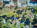 Aerial view showcases the property and outlines its boundaries in yellow at 7735 Westview Dr, Lakewood, CO 80214