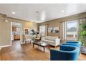 Inviting living room boasts hardwood floors and lots of natural light at 7735 Westview Dr, Lakewood, CO 80214