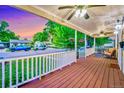 Expansive porch with white railing and views of the neighborhood at 2530 S Knox Ct, Denver, CO 80219