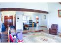 Inviting living room featuring hardwood floors, ample lighting, and an open floor plan at 271 S Salem Ct, Aurora, CO 80012
