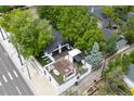 Aerial view of a modern home with a spacious rooftop deck and lush surroundings at 600 Garfield St, Denver, CO 80206