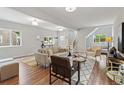 Open-concept living room featuring hardwood floors, modern furniture and plenty of natural light at 4142 Chase St, Denver, CO 80212