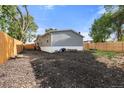 Spacious backyard featuring a fence, gravel landscaping, and potential for outdoor activities at 811 Plum N Ave, Lochbuie, CO 80603