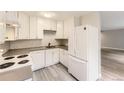 Modern kitchen featuring white cabinets, sleek countertops, and stainless steel appliances at 2160 S Vaughn Way # 104C, Aurora, CO 80014