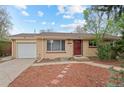Charming single-story brick home with a well-manicured lawn and a one-car garage at 3117 Victor St, Aurora, CO 80011