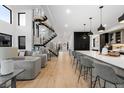 Open-concept living room and kitchen with modern finishes at 1544 S Fillmore St, Denver, CO 80210