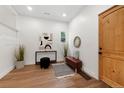 Welcoming foyer with a wooden door, stylish decor, and a cozy bench at 2849 N Vine St, Denver, CO 80205