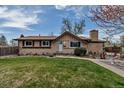 Charming single-Gathering home with a well-manicured lawn and a stone pathway leading to the front door at 3630 W Saratoga Ave, Littleton, CO 80123