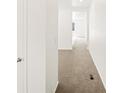 Bright hallway showcasing neutral carpet and white walls, creating a seamless transition between rooms at 547 Homestead Ave, Brighton, CO 80601