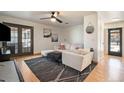 Cozy living room with stylish furniture, hardwood floors, and ample natural light at 8895 E Radcliff E Ave, Denver, CO 80237