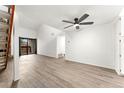 Bright living room with ceiling fan, wood floors, and sliding glass door to the balcony at 326 Wright St # 304, Lakewood, CO 80228