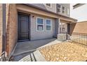 Charming townhome entrance featuring rock landscaping and an available sign at 6870 Merseyside Ln, Castle Pines, CO 80108