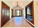 Welcoming entryway features elegant tile flooring, paneled doors, and large windows with natural light at 4600 S University Blvd, Englewood, CO 80113