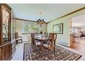 Formal dining room featuring a large window and a decorative chandelier at 4498 Buena Vista Ct, Castle Rock, CO 80109