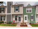 Inviting townhome exterior showcasing a cozy entrance and manicured landscaping at 19807 Victorian Way, Parker, CO 80138