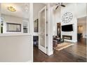 Sophisticated living room with high ceilings, hardwood floors, fireplace, and open layout design at 1882 W 67Th Ave, Denver, CO 80221