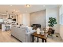 Cozy living room with an electric fireplace and open floor plan at 374 N Geneva St, Aurora, CO 80010