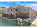 Attractive two-story home featuring neutral siding, well-kept landscaping, and individual garages at 18314 W 58Th Pl # 54, Golden, CO 80403