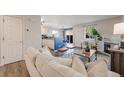 Bright and open floor plan connecting living room with fireplace and the kitchen at 18314 W 58Th Pl # 54, Golden, CO 80403