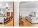 Spacious main bedroom with wood floors and vintage ceiling fan at 6023 E 6Th Avenue Pkwy, Denver, CO 80220