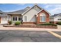 Charming home exterior with brick accents and well-maintained landscaping at 3205 E 102Nd Pl, Thornton, CO 80229