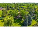 Sprawling property with lush greenery and mature trees at 4181 S Colorado Blvd, Cherry Hills Village, CO 80113