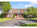 Charming brick home with a manicured lawn and inviting entryway at 4181 S Colorado Blvd, Cherry Hills Village, CO 80113