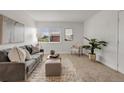 Cozy living room with neutral tones, comfortable furniture, and ample natural light at 3613 S Sheridan Blvd # 11, Denver, CO 80235