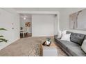 Inviting living room showcasing an open layout with dining area and cozy seating arrangements at 3613 S Sheridan Blvd # 11, Denver, CO 80235
