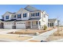 A street view of the new construction townhome with a two-car garage at 6554 N Malta St, Aurora, CO 80019