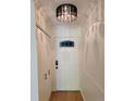 A well-lit entryway features a paneled door with decorative glass and a closet at 715 S Alton Way # 10A, Denver, CO 80247