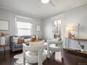 Bright living room showcasing modern decor, large windows, and comfortable seating area at 65 N Logan St # B4, Denver, CO 80203