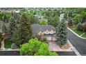 An aerial view of a two-story home, surrounded by mature trees in a neighborhood setting at 16416 E Powers Pl, Centennial, CO 80015