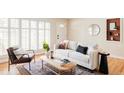 Bright living room with large windows, stylish furniture, and a cozy atmosphere at 9000 W 4Th Pl, Lakewood, CO 80226