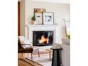 Inviting living room featuring a fireplace, comfortable seating, and elegant decor at 9000 W 4Th Pl, Lakewood, CO 80226