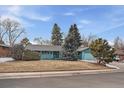 Charming single-story home features a well-maintained lawn and mature trees at 3831 S Hillcrest Dr, Denver, CO 80237