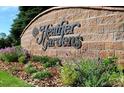 Heather Gardens community entrance sign with landscaping at 13631 E Marina Dr # 109, Aurora, CO 80014