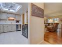 Bright kitchen featuring stainless steel appliances, white cabinetry, and ample counter space, enhanced by a skylight at 13631 E Marina Dr # 109, Aurora, CO 80014