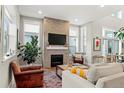 Inviting living room showcasing a modern fireplace with stylish decor and natural light at 5925 Hanover St, Denver, CO 80238